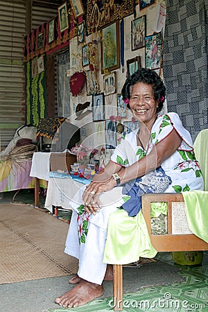 Elderly Fijian woman in home with christian altar and pictures of Jesus, Fijian home with religious photos and saints sculptures Editorial Stock Photo