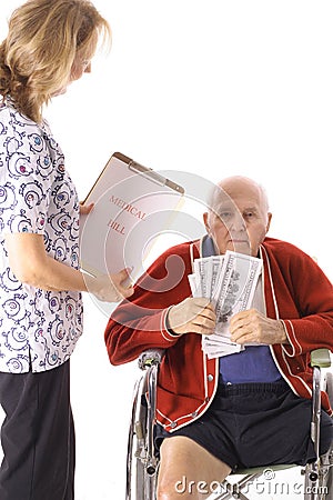 Elderly handicap senior paying medical bill Stock Photo