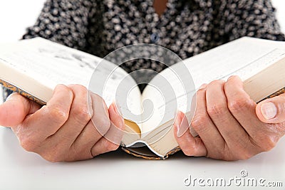 The elderly are holding a book and reading carefully Stock Photo