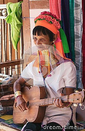 Elderly Kayan woman with a guitar. Editorial Stock Photo