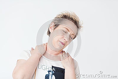 Elderly lady in excruciating neck tention Stock Photo