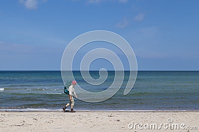 Elderly lady hiking on beach in Denmark Editorial Stock Photo