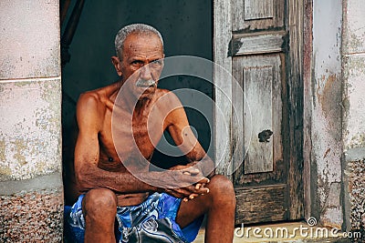 A elderly local posses for the camera in Trinidad, Cuba. Editorial Stock Photo
