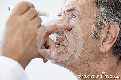 Elderly man examined by an ophthalmologist Stock Photo