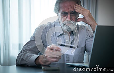 An elderly man experiencing financial difficulties. due to lack of saving during working age Stock Photo