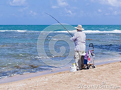 Elderly man fishing with a fishing rod Editorial Stock Photo