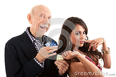 Elderly man with gold-digger companion or wife Stock Photo