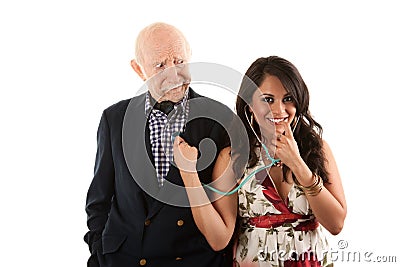 Elderly man with gold-digger companion or wife Stock Photo