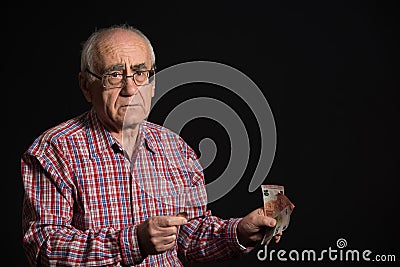 Elderly man with money Stock Photo