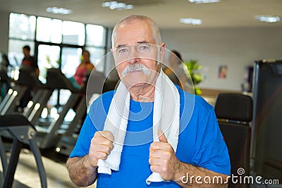 Elderly man posing in gym Stock Photo