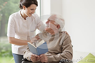 Elderly man reading book Stock Photo