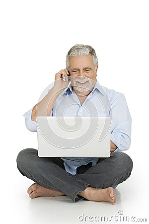 Elderly man using laptop Stock Photo