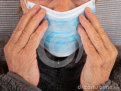 Elderly masked man. Caution Coronovirus. Take care of the elderly. Stock Photo