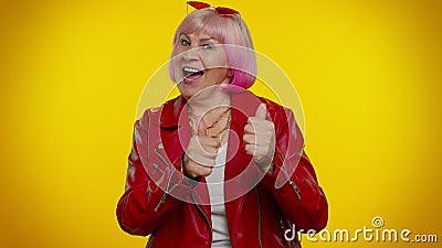 Elderly old woman granny celebrate success win scream rejoices doing winner hands gesture say Yes Stock Photo