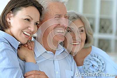 Elderly parents and their adult daughter Stock Photo