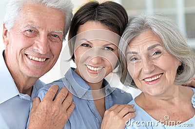 Elderly parents and their adult daughter Stock Photo