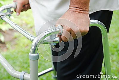 Elderly people catch walkers Help walk due to an inflamed knee. Stock Photo