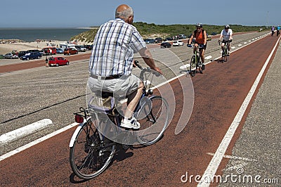 Elderly people cycling on Brouwersdam, Netherlands Editorial Stock Photo