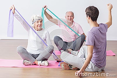 Elderly people do physical exercises Stock Photo