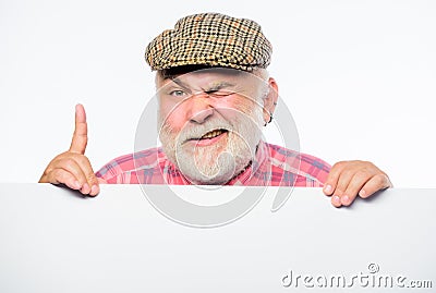Elderly person. Senior bearded emotional man peek out of banner place announcement. Pensioner grandfather in vintage hat Stock Photo