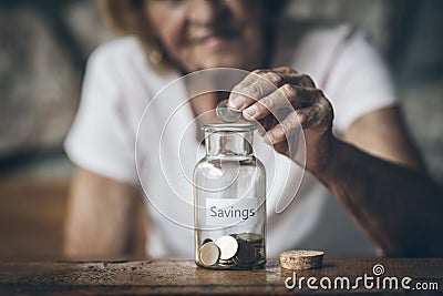 Elderly retired woman and her savings Stock Photo