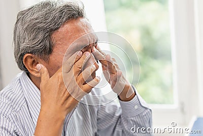 Elderly Self Eye Soothing Massage from irritation problem fatigue and tired Stock Photo