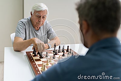 Elderly Senior Playing Chess Stock Photo