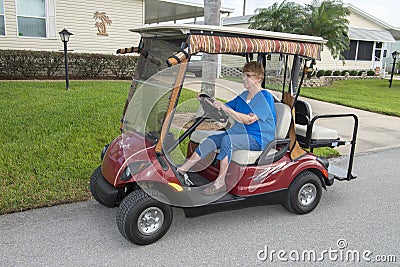 Elderly Senior Woman Retirement Community Golf Cart Stock Photo