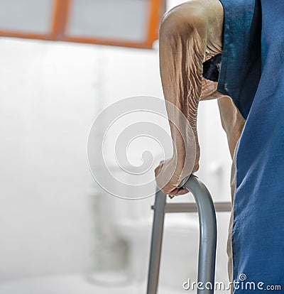 Elderly swollen feet or edema leg walk into bathroom Stock Photo