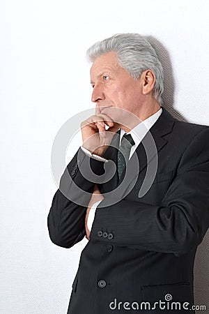 Elderly thoughtful businessman Stock Photo