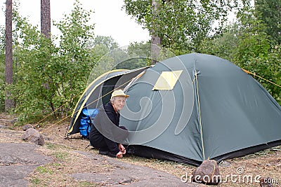 Elderly woman in camping Stock Photo