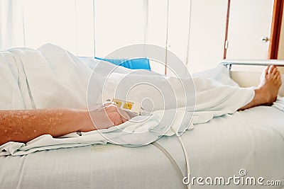 Elderly woman convalescing a bedridden disease Stock Photo
