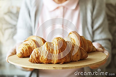 Elderly woman cooks french croissants, bare wrinkled hands, ingredients, soft warm morning light,top view Stock Photo