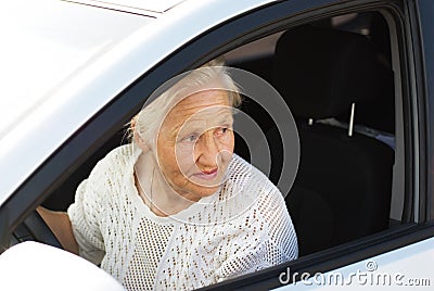 Elderly woman driving car Stock Photo