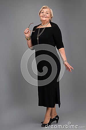 https://thumbs.dreamstime.com/x/elderly-woman-elegant-clothes-senior-closeup-beautiful-senior-wearing-black-dress-standing-against-grey-background-48967289.jpg
