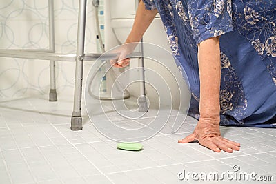 Elderly woman falling in bathroom Stock Photo