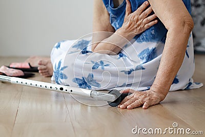 Elderly woman falling down at home ,hearth attack. Stock Photo