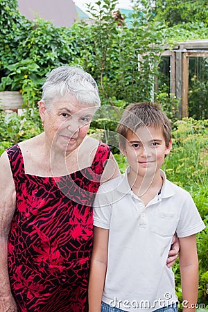 The elderly woman with the great-grandson on the nature Stock Photo