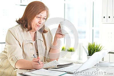 Elderly woman with a laptop Stock Photo