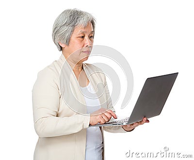 Elderly woman learn to use notebook Stock Photo