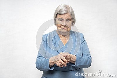 Elderly woman massages a painful palms Stock Photo