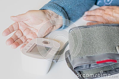 Elderly woman measures pressure, grandmother measures pressure Stock Photo