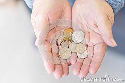 Elderly woman in money in her hands, grandmother holds money Stock Photo