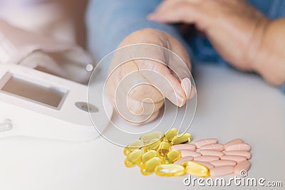 Elderly woman with pills hand, grandmother with medicines Stock Photo
