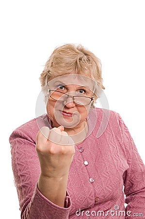 The elderly woman shows a fist Stock Photo