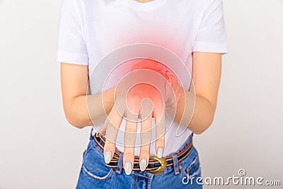 Elderly woman suffering from pain, weakness and tingling in wrist. Causes of hurt include osteoarthritis, rheumatoid Stock Photo