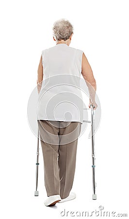 Elderly woman using walking frame isolated on white Stock Photo