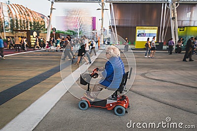 Elderly woman visiting Expo 2015 in Milan, Italy Editorial Stock Photo