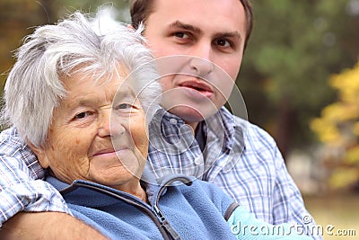 Elderly woman and young man Stock Photo