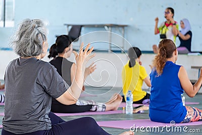 Elderly in a yoga exercise posture Editorial Stock Photo